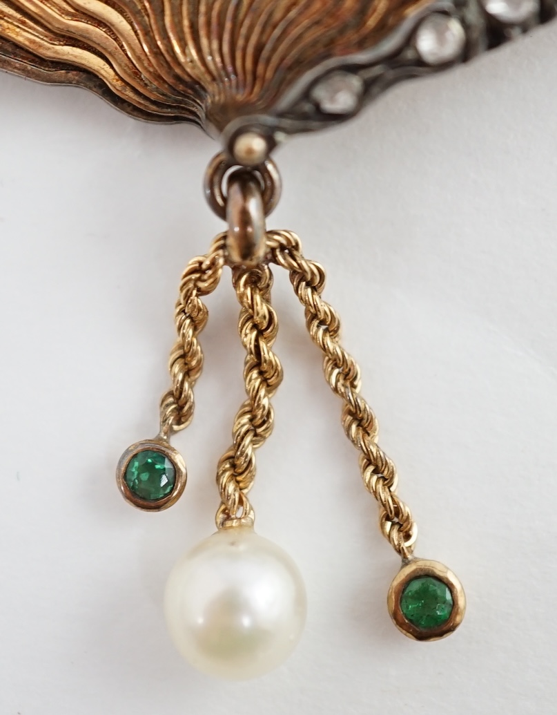 A gold (test as 15ct), emerald, rose cut diamond and enamel set brooch, modelled as a fan with applied parrot on a branch